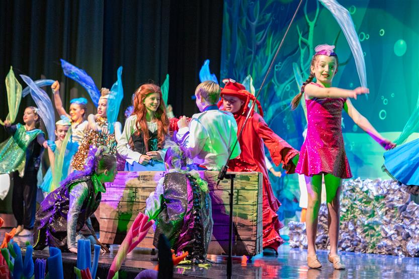 Students perform onstage